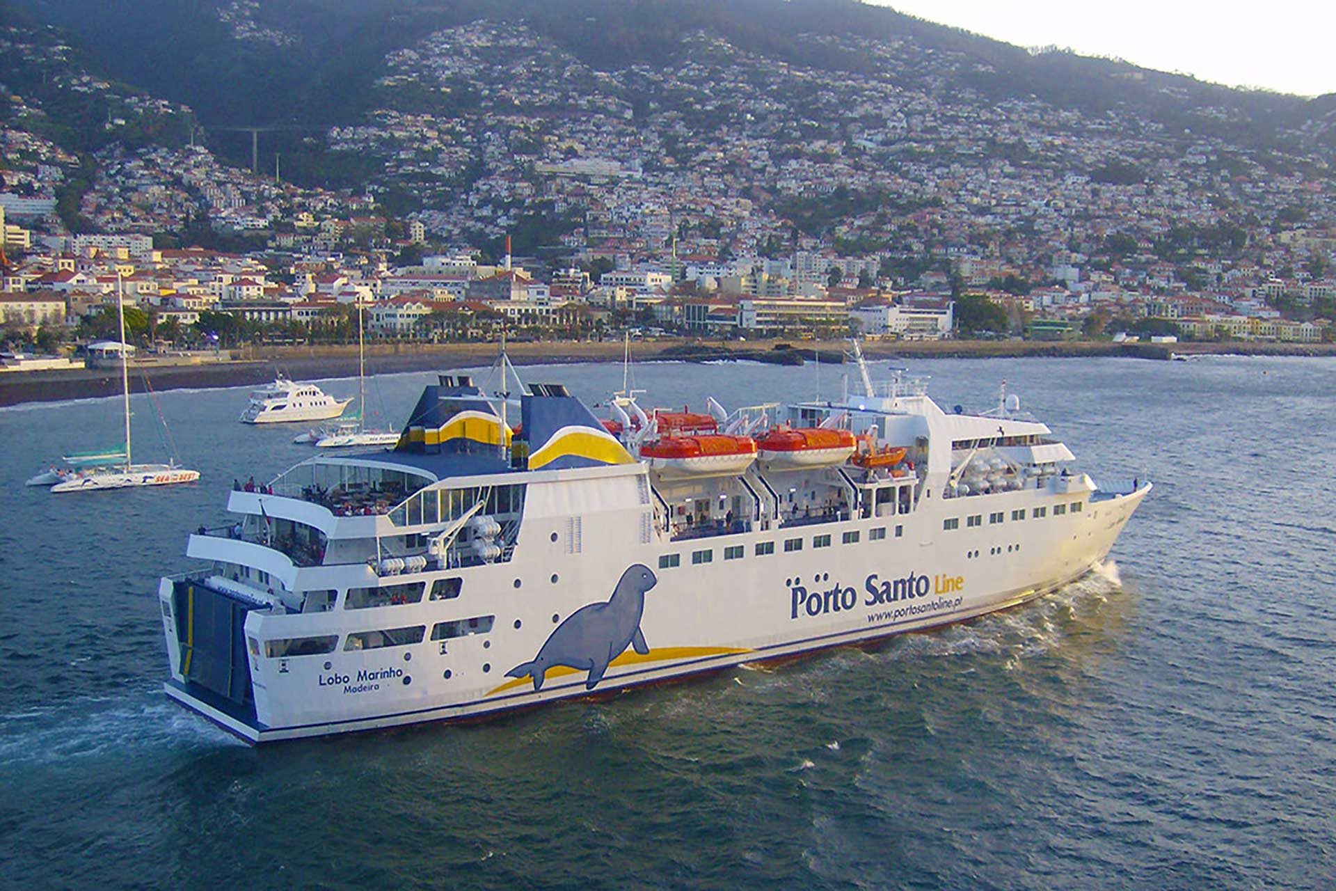 The Lobo Marinho ferry leaving Funchal harbour with the city rising up the hillside behind it
